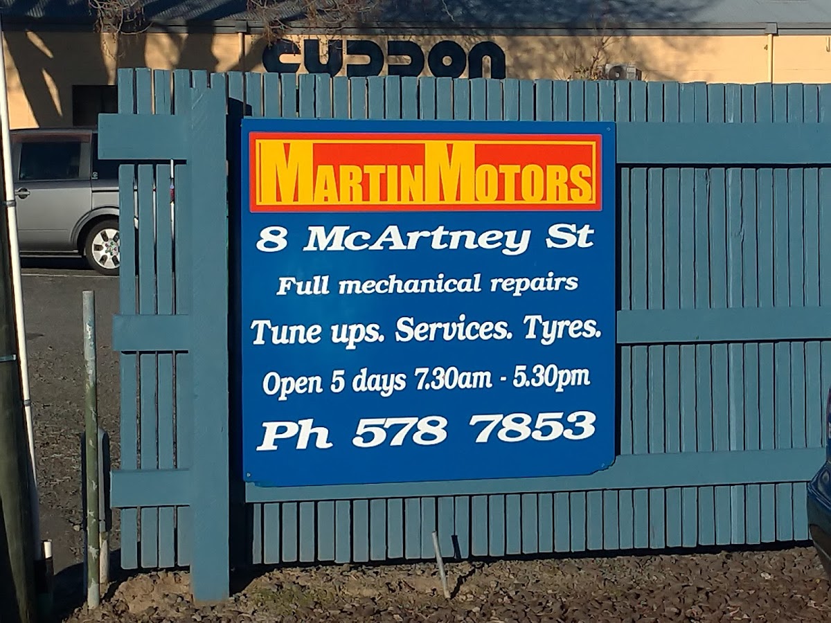The Martin Motors signboard listing full mechanical repairs, tune ups, services and tyres
