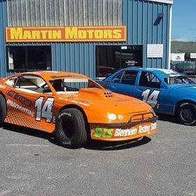 The orange Martin Motors number 14 stock car